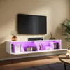 A modern living room with a wall-mounted TV and a white media console featuring LED lighting. Anteprima dell’immagine prodotto
