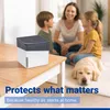 A family and their dog relaxing in a living room with a dehumidifier on a coffee table. Produktbild-Vorschau