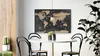 A world map metalboard hangs on a wall above a round dining table with chairs, next to a potted plant and a cactus. Náhľad obrázku produktu