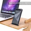 A laptop and a smartphone are placed on a wooden desk. Produktbild-Vorschau