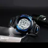 A close-up shot of a blue and black digital watch with a black background. Náhled obrázku produktu
