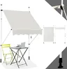 A beige awning is shown extended over a small table and chair setup on a white background. Podgląd zdjęcia produktu