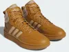 A pair of brown Adidas Hoops Mid high-top sneakers with beige accents. Anteprima dell’immagine prodotto