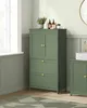 A green bathroom cabinet with two doors and two drawers, placed in a bathroom setting with a window and another cabinet visible. Náhled obrázku produktu