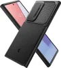 A black phone case is shown diagonally, with two phones partially visible underneath. Podgląd zdjęcia produktu