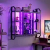 A gaming shelf with LED lights displaying various items like figurines, headphones, and controllers. Produktbild-Vorschau