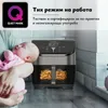 A person is holding a sleeping baby next to an air fryer. Produktbild-Vorschau