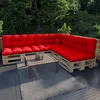 Outdoor patio furniture set with red cushions on wooden pallets, a coffee table, and a rug. Produktbild-Vorschau