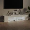 A modern TV stand with LED lighting, displaying decorative items and books. Anteprima dell’immagine prodotto