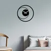 A modern wall clock is mounted on a light gray wall above a bed with pillows. Anteprima dell’immagine prodotto