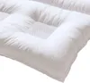 A close-up, angled view of a white down comforter with quilted sections and a mesh insert in the center of one section. A subtle logo is embossed on the lower right corner. Produktbild-Vorschau