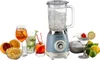 A retro-style blue blender is surrounded by ingredients and drinks for making cocktails. Anteprima dell’immagine prodotto