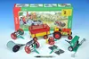 A toy farm set with tractors and agricultural implements, displayed in front of its packaging. Náhled obrázku produktu
