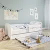 A child's bedroom with a white bed, toys, and decorations. Produktbild-Vorschau