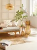 A cozy living room scene with a daybed, rug, and decorative items. Anteprima dell’immagine prodotto