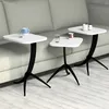 Three white side tables with black legs are placed next to a light gray sofa. Produktbild-Vorschau