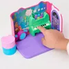 A child's hand is playing with a toy music set. Produktbild-Vorschau