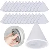 A hand is shown holding a round, gray object with white trim, possibly a vent or filter housing. In the background, rows of white, triangular filter inserts are arranged. A single conical filter insert is also shown in the foreground. Produktbild-Vorschau