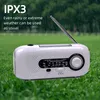 A white radio is shown outdoors in the rain, with text overlays highlighting its weather resistance. Produktbild-Vorschau