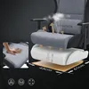 An exploded view of a gaming chair's seat cushion, highlighting its layered construction and breathability features. A hand is shown pressing into the cushion, and arrows indicate airflow. Produktbild-Vorschau