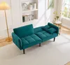 A teal futon sofa is shown in a living room setting with a floor lamp and a bookshelf. Anteprima dell’immagine prodotto