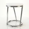A white round stool with a chrome-plated metal frame against a white background. Produktbild-Vorschau