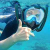 A person snorkeling underwater, giving a thumbs up. Podgląd zdjęcia produktu