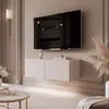 A modern living room with a wall-mounted TV and media console. Voir les images du produit