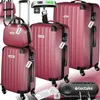 A collection of red hard-shell suitcases and a beauty case, along with a luggage scale and a combination lock, displayed on a textured background. Náhled obrázku produktu