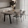 A dining table with chairs in a modern kitchen setting. Podgląd zdjęcia produktu
