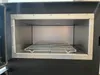 Interior view of a modern fireplace or oven with a metal rack. Produktbild-Vorschau