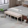 A bedroom scene with a bed, a bench, and a rug. Anteprima dell’immagine prodotto