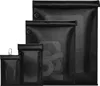 Four black Faraday bags of varying sizes are displayed side-by-side against a white background. Podgląd zdjęcia produktu