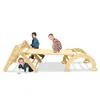 Children playing on a wooden climbing structure.