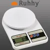A white kitchen scale is shown against a gray background. Voir les images du produit