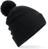 A black beanie with a pom-pom on top, shown against a white background. Anteprima dell’immagine prodotto