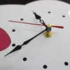 Close-up view of a clock face with hands. Produktbild-Vorschau