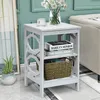 A gray side table with books and a basket on it, placed next to a couch in a living room. Podgląd zdjęcia produktu