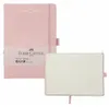 A pink Faber-Castell notebook is shown, with one notebook closed and another open to display its grid-lined pages. Voir les images du produit