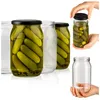 Several glass jars filled with pickles are arranged on a white background. One jar is being held by a hand, and another empty jar is also shown being held by a hand. Produktbild-Vorschau