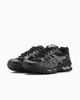 A pair of black ASICS Gel-Kayano 14 running shoes with silver accents, shown from a side-front angle on a white background. Produktbild-Vorschau