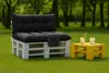 Outdoor seating area with pallet furniture and drinks. Produktbild-Vorschau