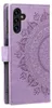 A close-up side view of a purple flip phone case with a mandala design. Produktbild-Vorschau