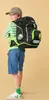 A young boy wearing a backpack, shown from the back and side. Náhled obrázku produktu