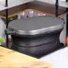A cast iron pot with a lid sits on a black induction stovetop. Produktbild-Vorschau