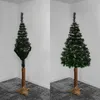 Two artificial Christmas trees are shown side-by-side in a room corner. The left tree is partially fluffed, while the right tree is fully fluffed. Produktbild-Vorschau
