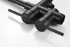 A close-up studio shot of a matte black faucet with two handles and a showerhead connection. Produktbild-Vorschau