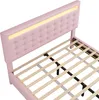 A pink upholstered bed frame with a tufted headboard and integrated LED lighting. Produktbild-Vorschau