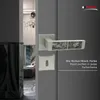 A close-up of a door handle and escutcheon plate on a gray door. Produktbild-Vorschau