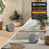 A Brandson heater is shown in a modern bathroom and living room setting. Anteprima dell’immagine prodotto